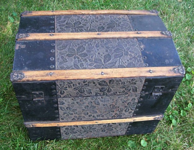 T118 - Antique Embossed Metal Doll Trunk