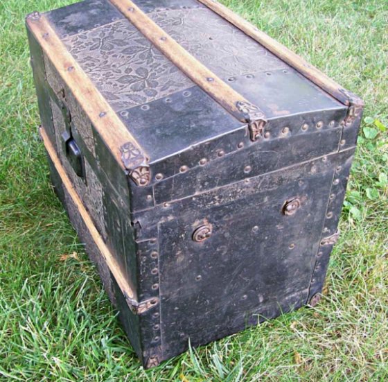 T118 - Antique Embossed Metal Doll Trunk